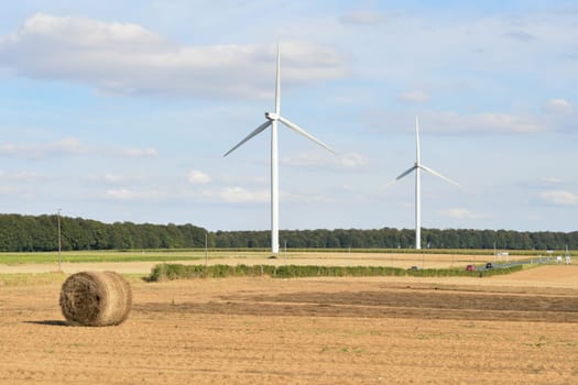 Windmills near the field of flax Normandy, France