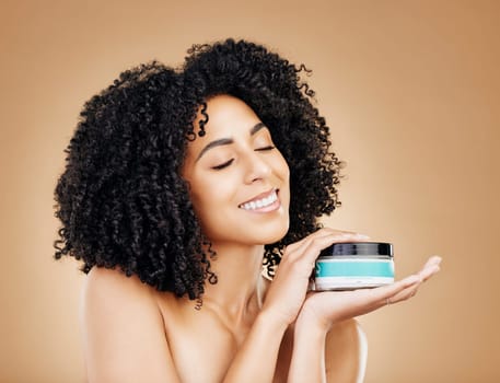 Happy woman, container and hair, product for curls and shine, beauty with smile and strong texture on studio background. Advertising, haircare cosmetics for growth and cosmetology with model and afro.