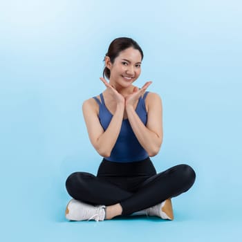 Full body asian woman in sportswear portrait, smiling and posing cheerful gesture. Workout training with attractive girl engage in her pursuit of healthy lifestyle. Isolated background Vigorous