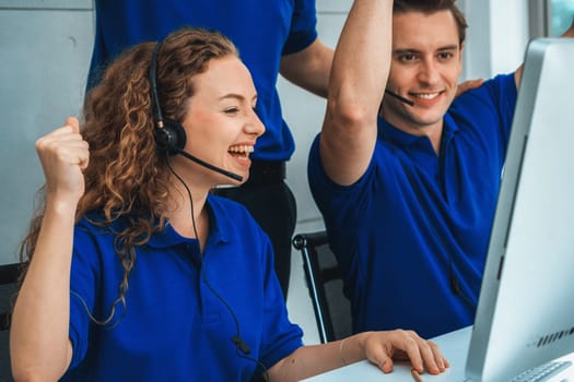 Business people wearing headset celebrate working in office . Call center, telemarketing, customer support agent provide service on telephone video conference call. Jivy