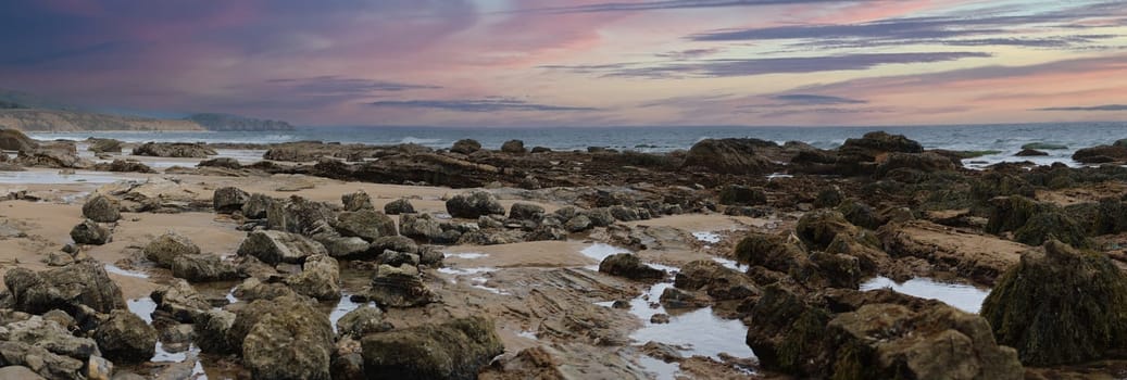 Panoramic tide pools, at Newport beach coastal Crystal Cove, sand, beach, waves and rocks. At sunset. High quality photo