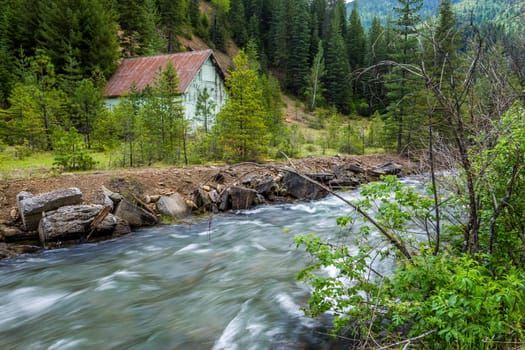 An old barn stands by Canyon Creek near Wallace, Idaho.
