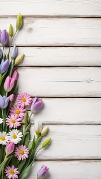 Colorful Spring Flowers on Wooden Background.A vibrant and colorful arrangement of various spring flowers, including daisies, tulips, and other blossoms, placed on a light blue and white wooden background. The flowers are positioned along the left side of the image, creating a beautiful and natural border. The combination of different flower types and colors, such as white, pink, purple, yellow, and blue, adds a cheerful and fresh feel to the image, making it perfect for spring-themed designs, backgrounds, or advertisements.