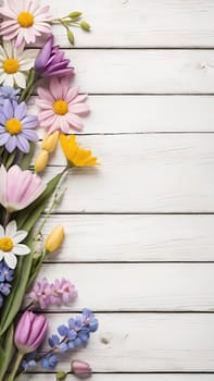 Colorful Spring Flowers on Wooden Background.A vibrant and colorful arrangement of various spring flowers, including daisies, tulips, and other blossoms, placed on a light blue and white wooden background. The flowers are positioned along the left side of the image, creating a beautiful and natural border. The combination of different flower types and colors, such as white, pink, purple, yellow, and blue, adds a cheerful and fresh feel to the image, making it perfect for spring-themed designs, backgrounds, or advertisements.