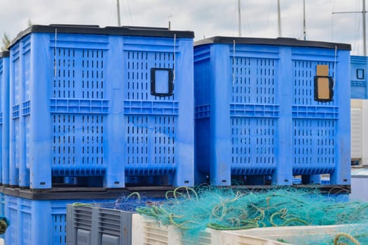 Plastic containers of fishing nets in the port.