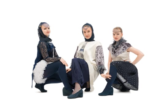 Pretty girls in artistic design costumes isolated view on white