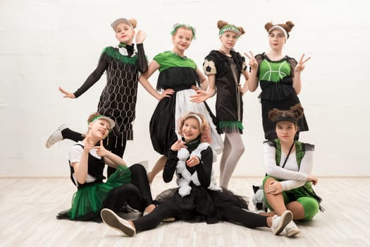 Girls wearing fashion green and black costumes isolated view