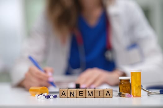 A healthcare professional is discussing anemia in detail while also noting key information and important points