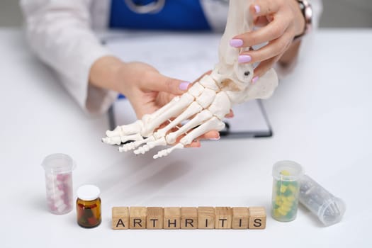 A hand demonstrating foot anatomy complexities and options for arthritis treatment in a closeup view