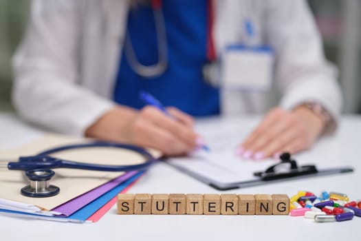 A healthcare professional documenting stuttering therapy plans, emphasizing communication disorders.