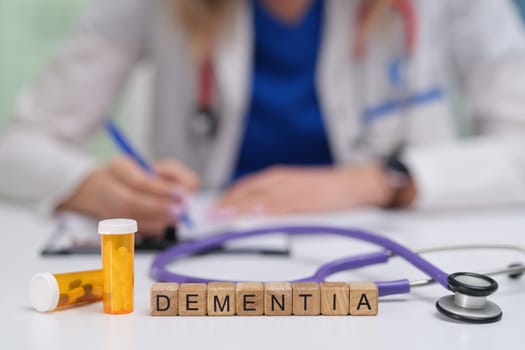 A medical professional documents the care for a dementia patient, with medication clearly visible on the table
