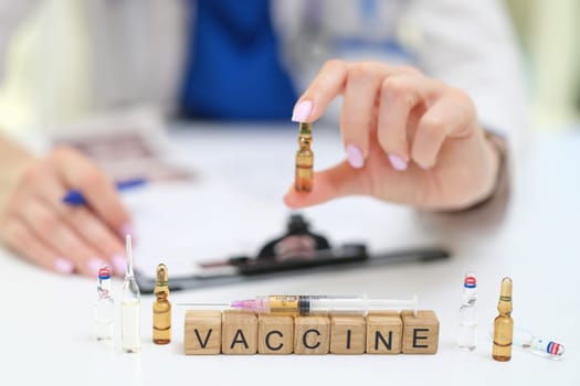 A health professional carefully handles vaccine vials, highlighting the vital importance of vaccination and health care