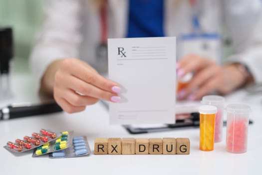 Closeup of a prescription pad showing various medications and RX drug blocks in a clinical setting