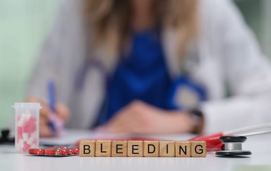 A healthcare professional assesses a bleeding condition with specialized tools, making detailed notes