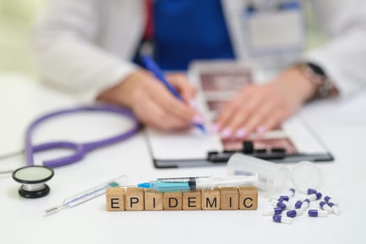 A healthcare professional documents responses to an epidemic using medical tools to ensure accuracy and efficiency