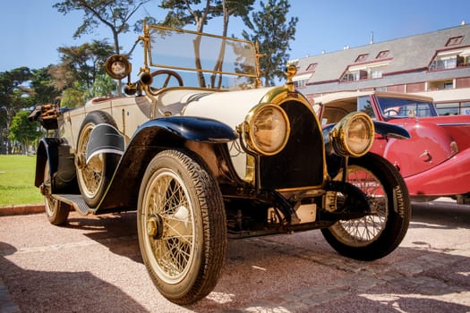 Lisbon, Portugal - Sep 29, 2024: Rare vintage white car Diatto Tipo 20s with vaulted grille on sunny day. Unique car design, quality vehicle, 1920s race cars, Diatto, Turin, Italy