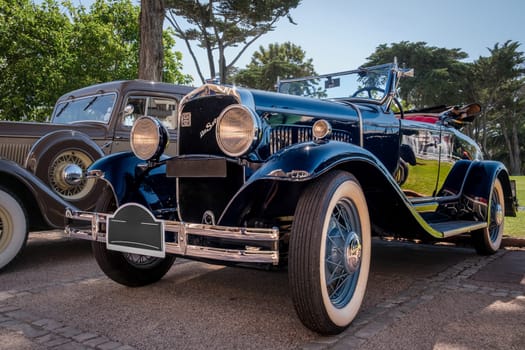 Lisbon, Portugal - Sep 29, 2024: Original De Soto Straight 8 Tourer built in 1930 on sunny day near park, De Soto cheapest model, Chrysler Corp, USA. Family size car, soft top down.
