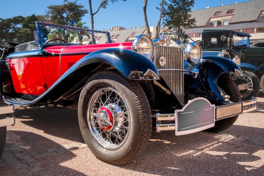 Lisbon, Portugal - Sep 29, 2024: Luxury Mercedes-Benz 370 S Mannheim sport cabriolet on sunny day. 2-door roadster, touring class car, 1930s, known as Mercedes-Benz W10 in two-tone or two-color scheme of black and red by Mercedes-Benz AG, Germany