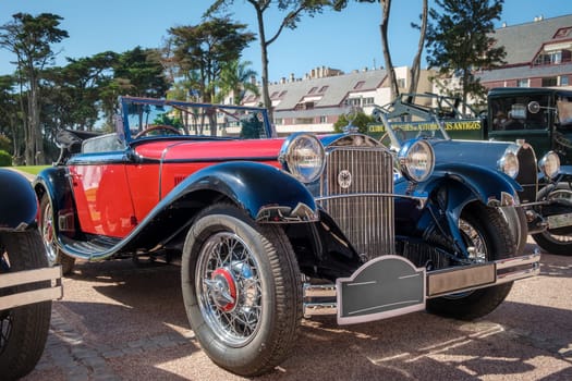 Lisbon, Portugal - Sep 29, 2024: Luxury Mercedes-Benz 370 S Mannheim sport cabriolet on sunny day. 2-door roadster, touring class car, 1930s, known as Mercedes-Benz W10 in two-tone or two-color scheme of black and red by Mercedes-Benz AG, Germany