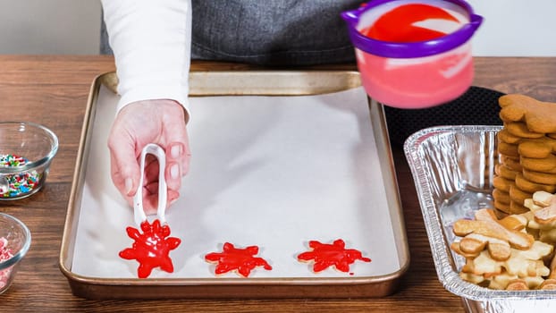 Crafting gingerbread cookie sandwiches with eggnog buttercream, presented on a rustic wooden table for Christmas gifting.