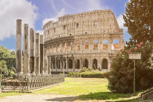 View of the Roman Colosseum from Santa Francesca Romana square. On the sign: Santa Francesca Romana Square