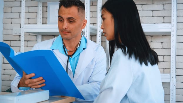 Doctor in professional uniform examining patient at hospital or medical clinic. Health care , medical and doctor staff service concept. Jivy