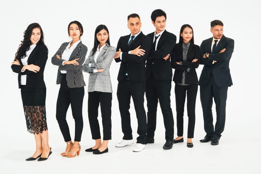 Successful business people standing together showing strong relationship of worker community. A team of businessman and businesswoman expressing a strong group teamwork at the modern office. Jivy