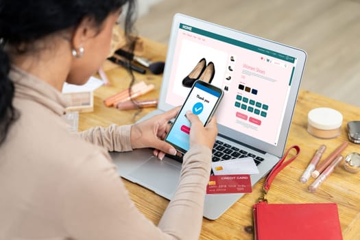 Woman shopping online on internet marketplace browsing for sale items for modern lifestyle and use credit card for online payment from wallet protected by crucial cyber security software