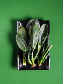 amazing green vitamin fresh spinach. Garnish. View from above. Chinese cuisine, hotpot ingredient