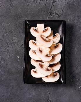 fresh and raw champignon mushrooms. View from above. Chinese cuisine, ingredient for hotpot