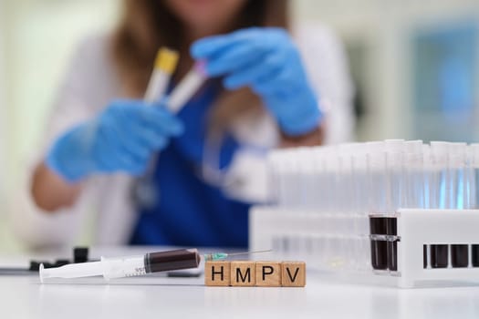 A healthcare professional meticulously working with various blood samples within a controlled laboratory setting