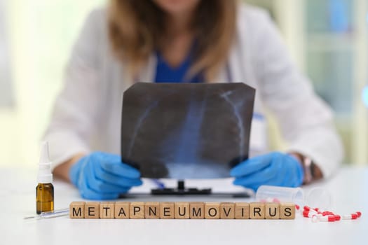 A healthcare professional meticulously examines Xray results to detect Metapneumovirus in patients