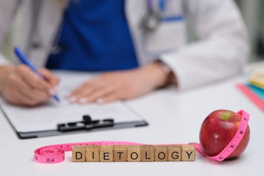 A workspace meant for a healthcare professional that prominently features various dietology elements