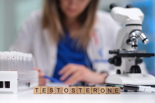 In a laboratory environment, a scientist meticulously analyzes testosterone samples using a highpowered microscope