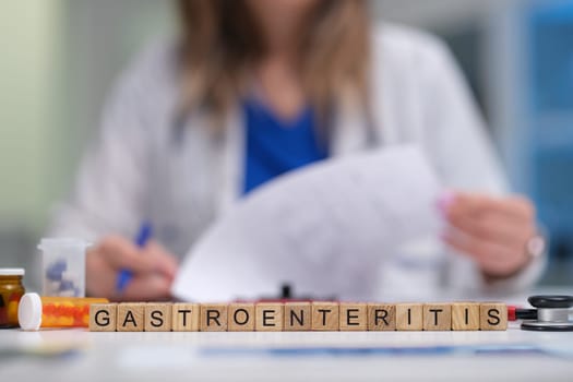 A medical professional is reviewing key documents on gastroenteritis treatment and patient care for quality service