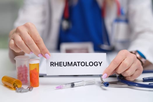 A dedicated healthcare professional presenting important rheumatology information along with essential medical supplies