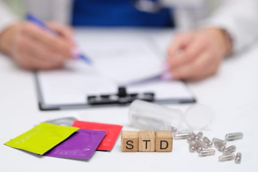 A doctor discusses STD treatments, including medications and educational packets for patient understanding