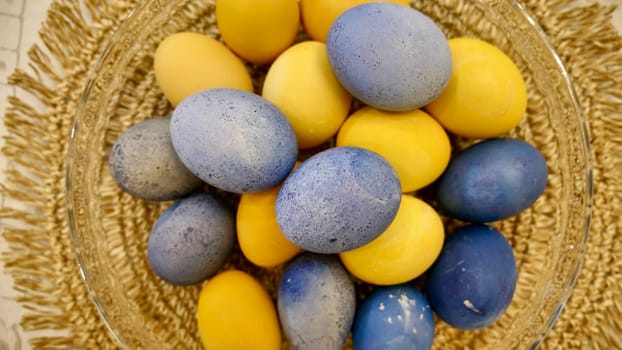 Yellow-blue eggs for Easter, patriotic Ukrainian traditions. Close-up