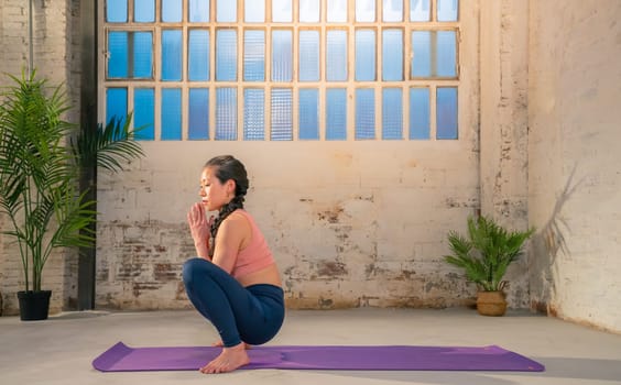 Asian woman practicing yoga pose. High quality photo