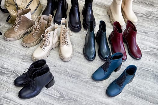 Different styles of trendy shoes are displayed neatly on the floor, showcasing the latest fashion trends in footwear
