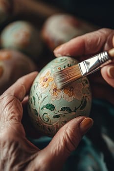 Close-up of a woman coloring eggs for Easter. Selective focus.