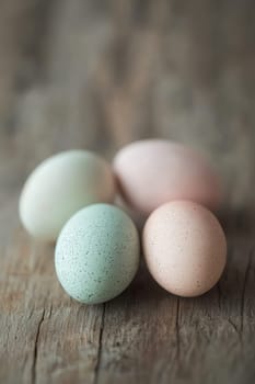 Close-up of painted eggs on a wooden table. Selective focus.