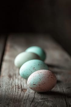 Close-up of painted eggs on a wooden table. Selective focus.