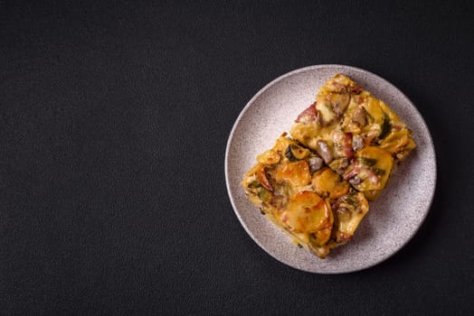 Shepherd's pie with potatoes, meat, vegetables, salt, spices and herbs on dark concrete background