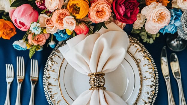 Elegant royal dining table adorned with luxurious floral arrangements for wedding or event, vintage tableware, and candles in a classic English countryside manor, creating a romantic and sophisticated atmosphere idea