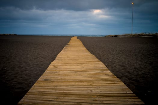 View on Playa de Santa Cruz de La Palma, beach with wooden walkway on La Palma, Canary Islands, Spain