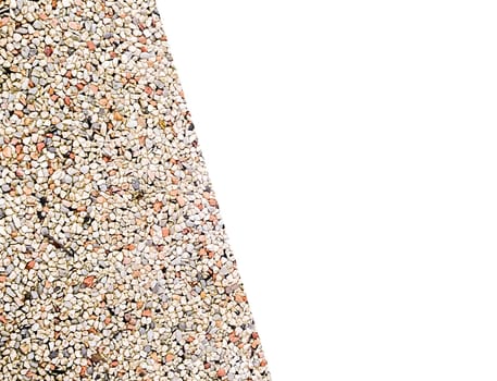 Small, colorful pebbles form an intricate pattern on an outdoor surface, reflecting sunlight and creating a visually appealing texture. The vibrant stones enhance the landscaping.