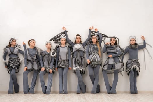 Young dancers in fantastic space costumes full-length isolated shot