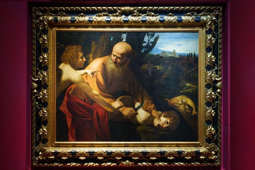 Florence, Italy, January 4, 2024: Sacrifice of Isaac. Caravaggio. Uffizi Gallery painting, Florence