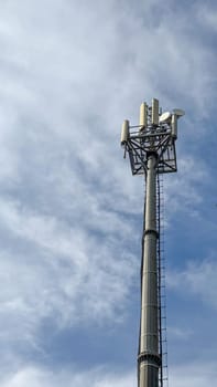 Mobile data tower with antennas against a blue sky. The concept of telecommunication equipment, high-speed mobile communication. High quality photos